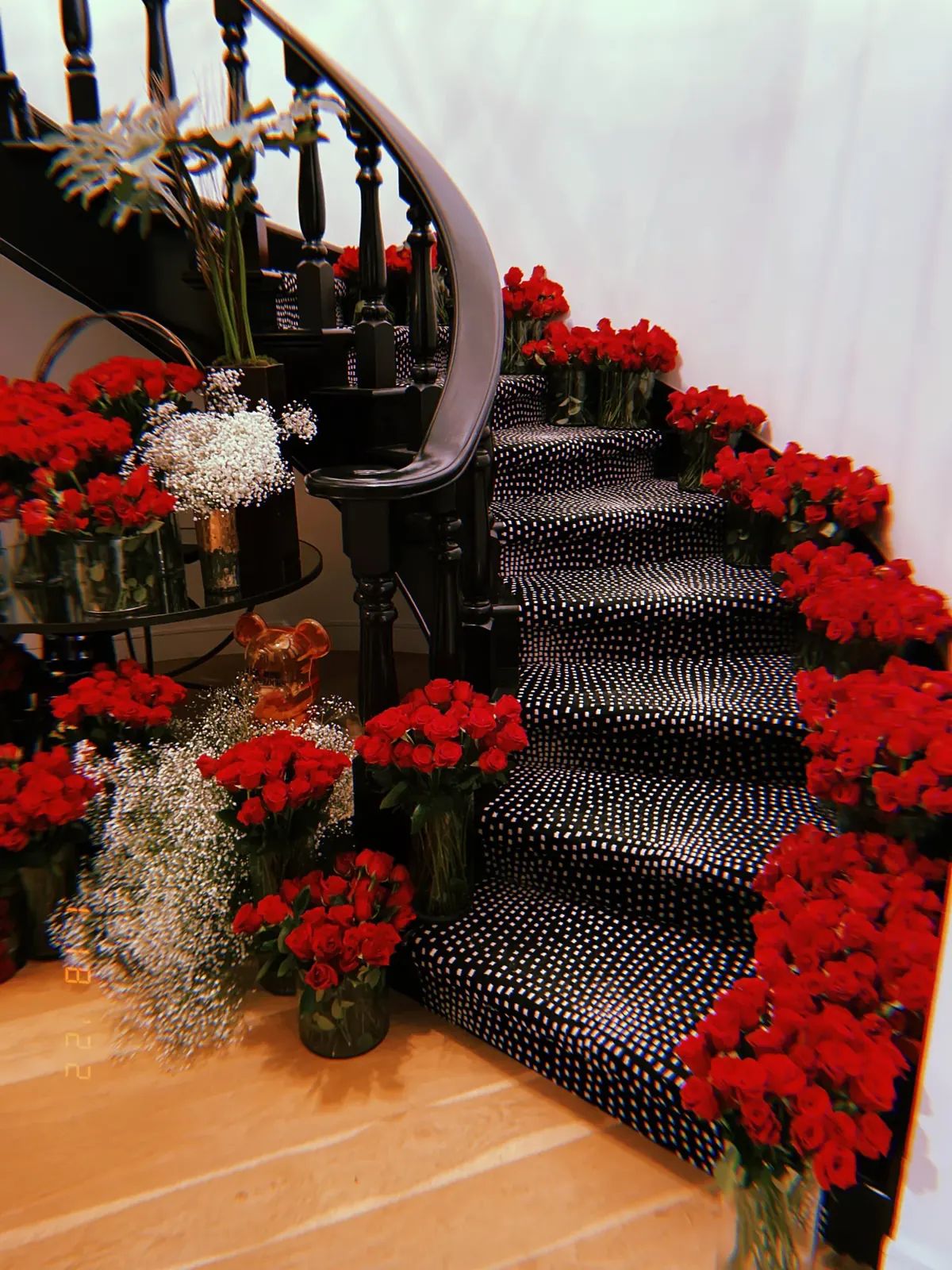 Red roses lining a staircase